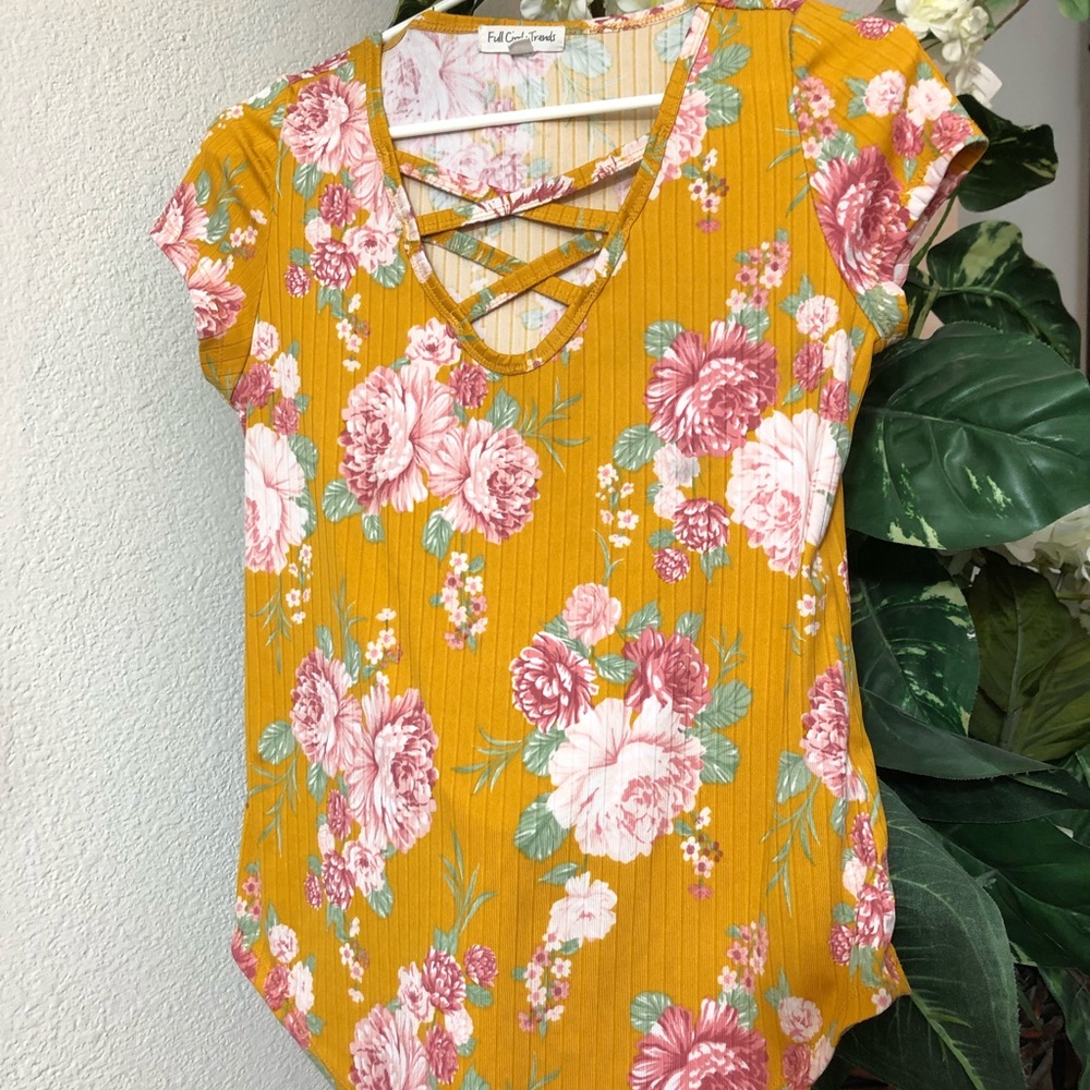 NEVER worn. Full Circle Trends crisscross floral blouse